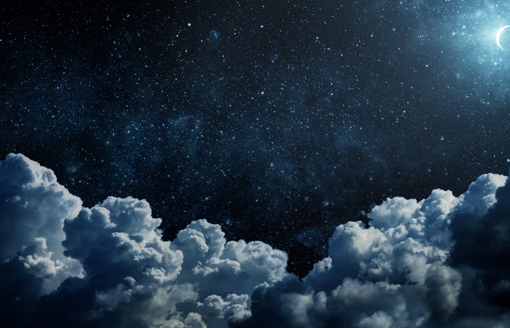 A night sky filled with stars and a crescent moon above large, dark clouds.