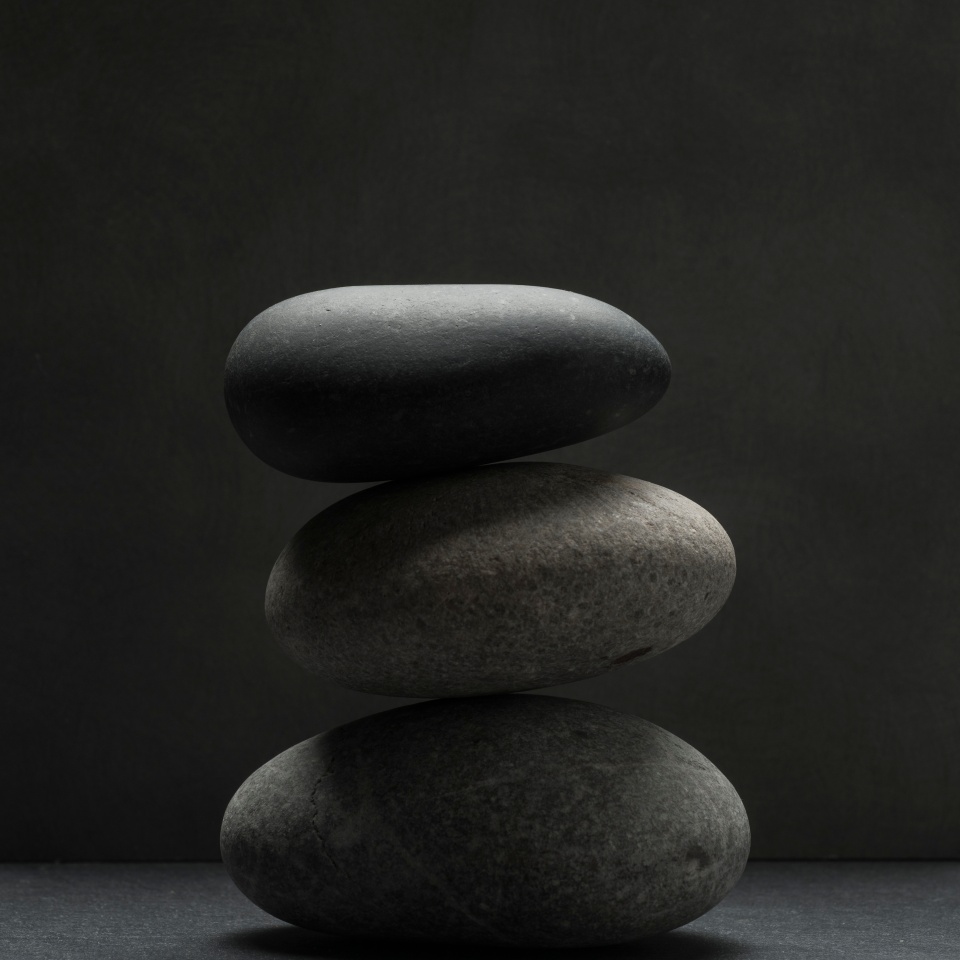 zen stones for podium background .three zen stones on dark background with shadows
