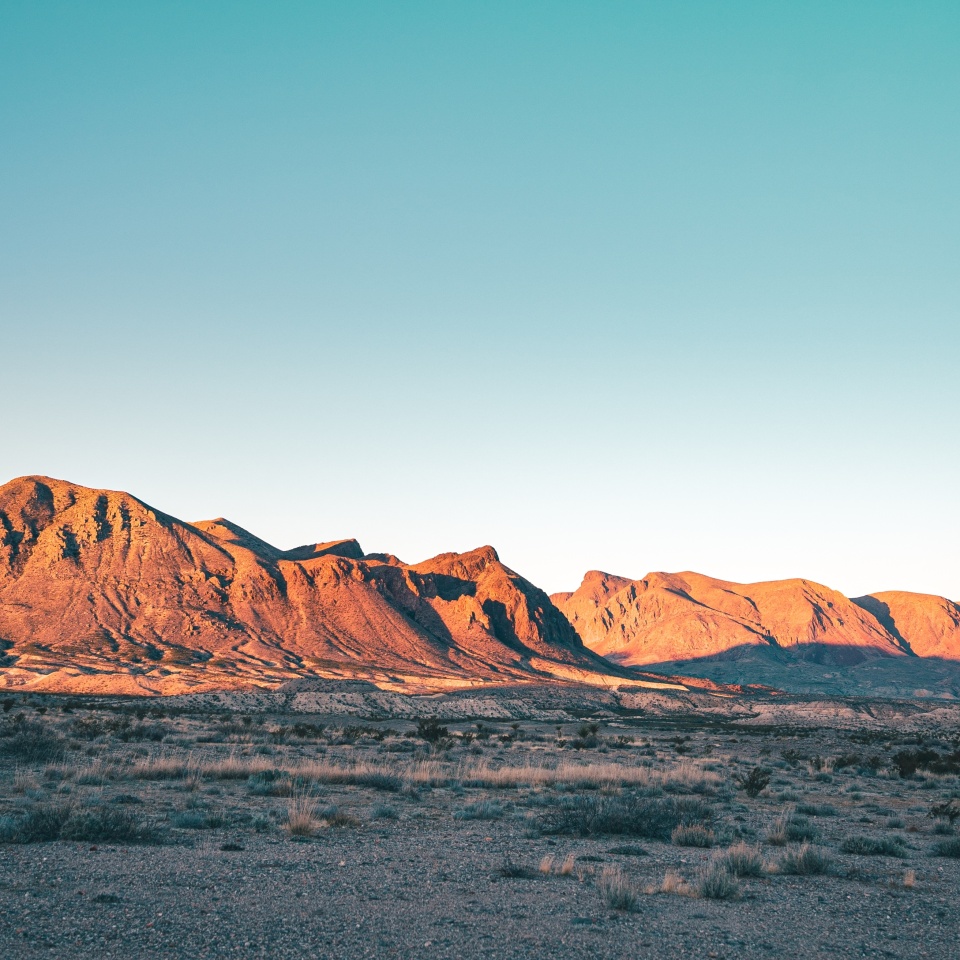 Vertical view of desert mountains and (probably) Jupiter