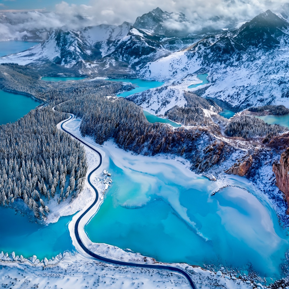 Overhead view of a road through a snow covered landscape in the far north of Canada - AI generated