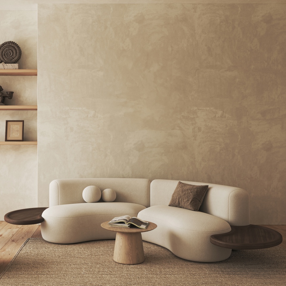 Stylish curved modern sofa in a minimalist living room setting with chic wooden side tables and soft rug. 3D Illustration