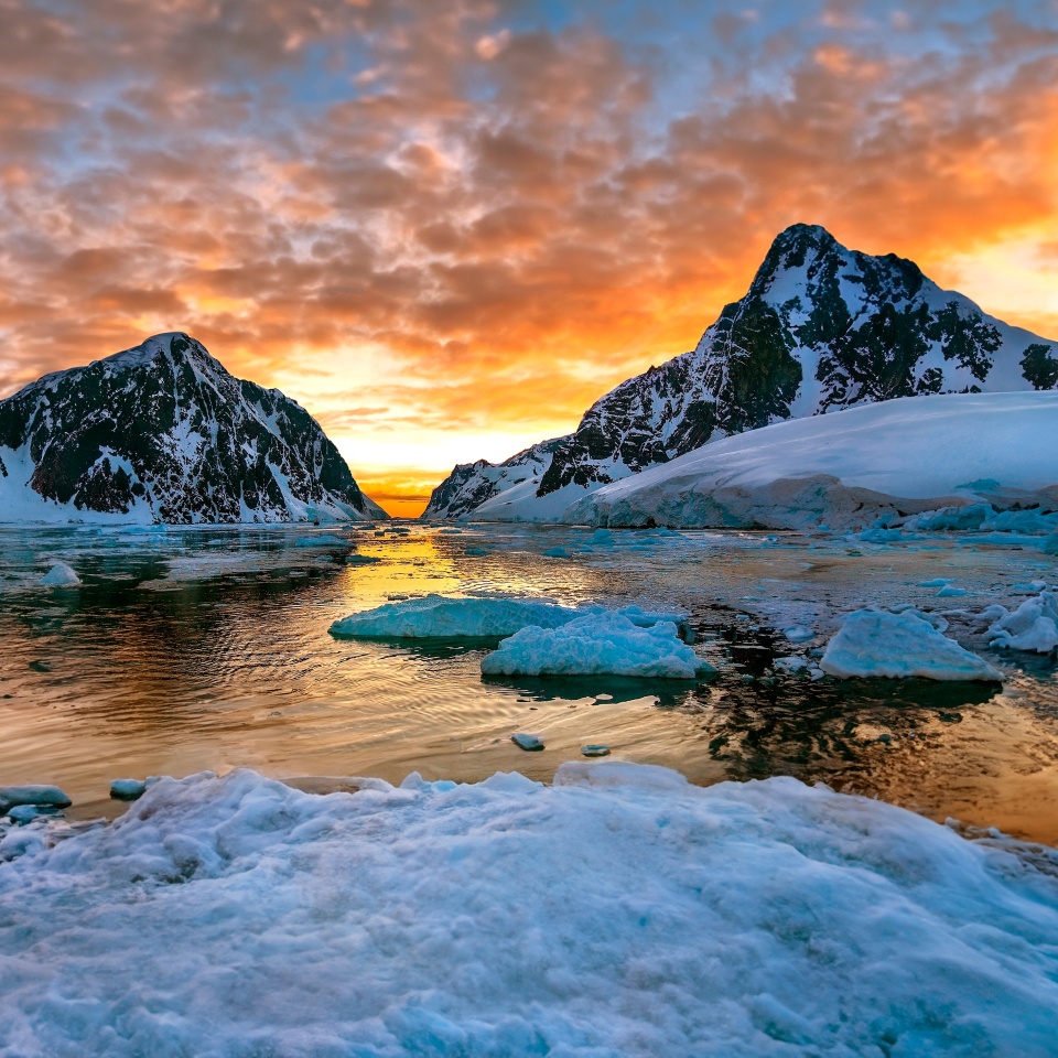 Midnight Sun and the entrance to the Lamaire Channel on the Antarctic Peninsula in Antarctica.