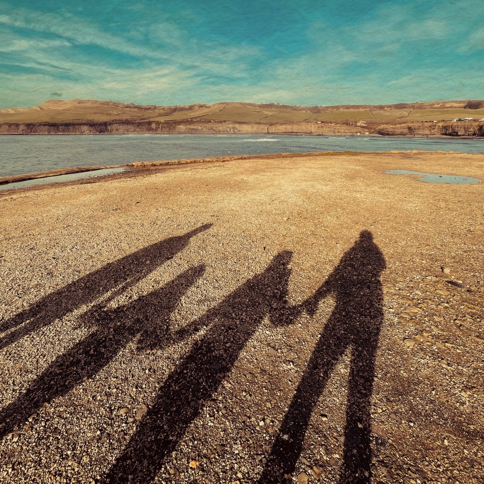 Family shadow on the beach