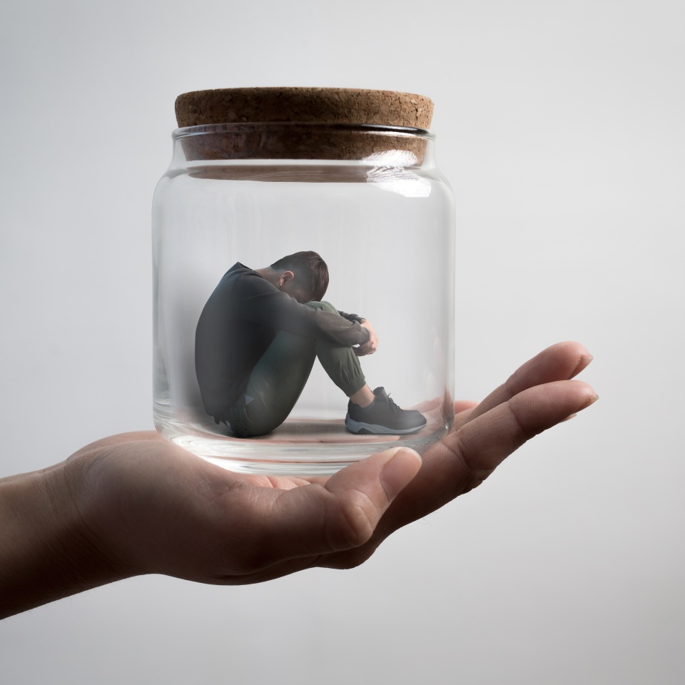 the depression man sit imprisoned in jar